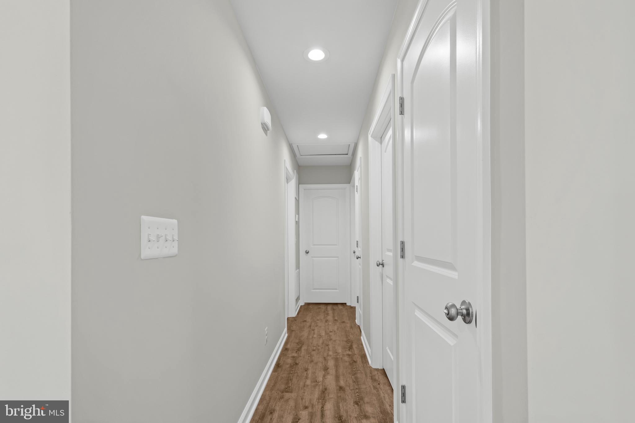 172 Martins Farm Road Front Royal, VA 22630 - Photo 6 of 22 a view of a hallway with wooden floor