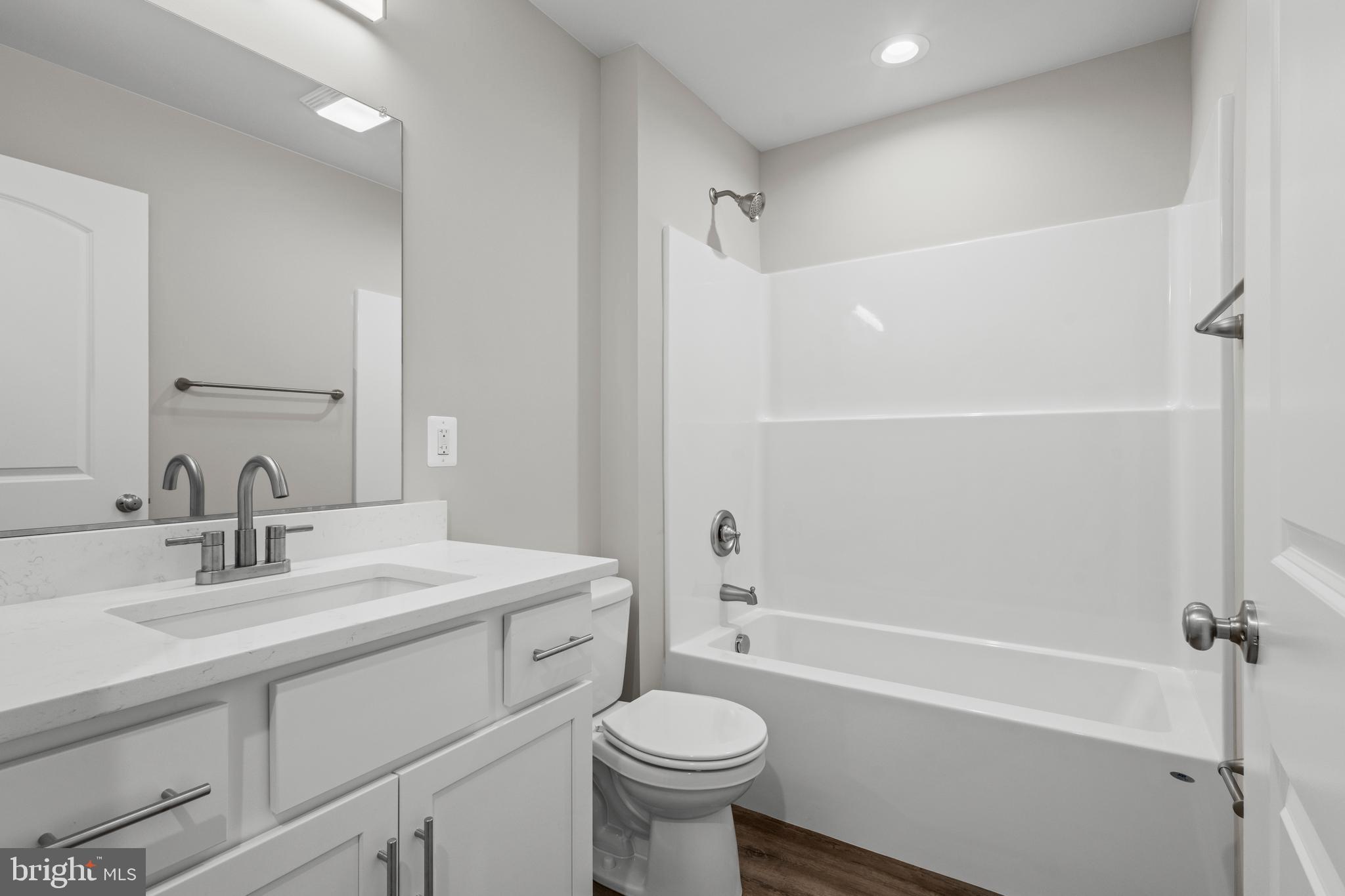 172 Martins Farm Road Front Royal, VA 22630 - Photo 7 of 22 a bathroom with a sink toilet vanity and shower