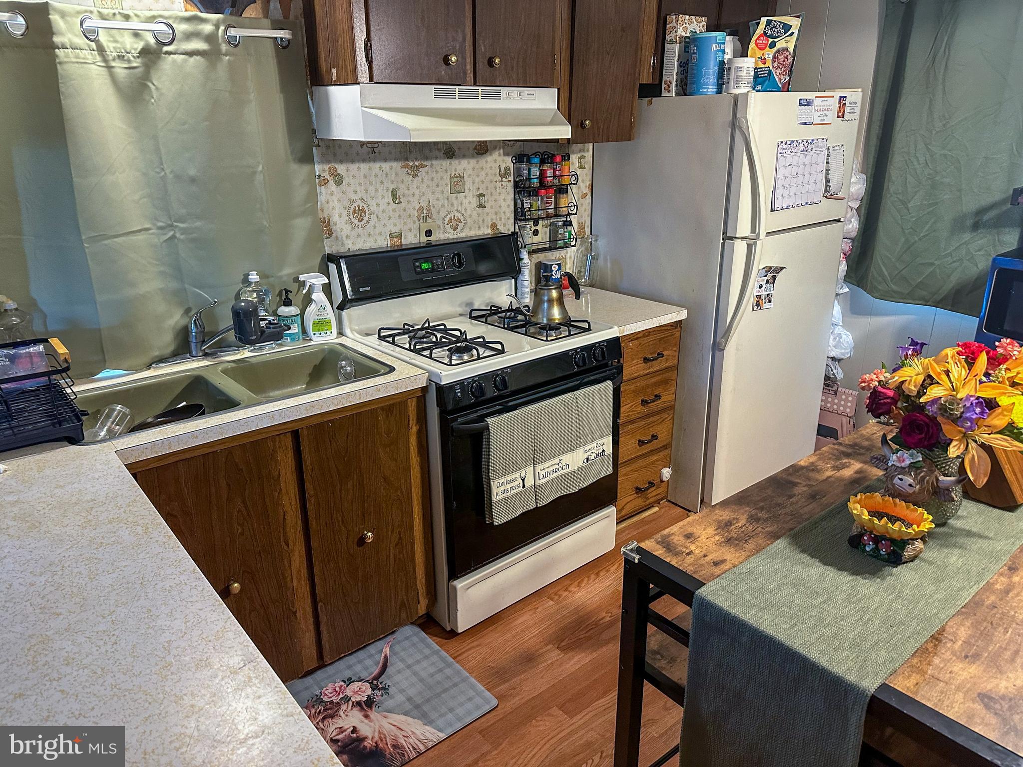 12 Oneill Avenue Hanover, PA 17331 - Photo 5 of 14 a kitchen with stainless steel appliances granite countertop a table a stove and a refrigerator