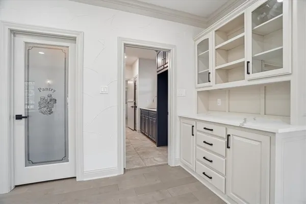 a view of closet with cabinet