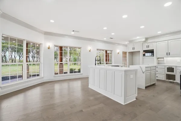 a view of kitchen with center island and stainless steel appliances