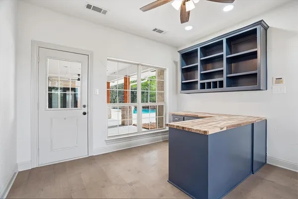a kitchen that has a stove and a microwave oven