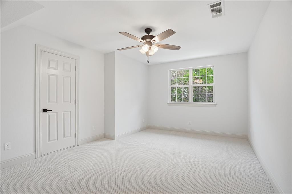 1430 Black Hawk Trail Nemo, TX 76070 - Photo 20 of 40 an empty room with windows and fan