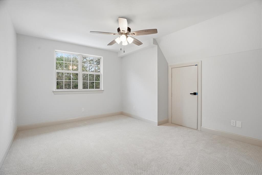 1430 Black Hawk Trail Nemo, TX 76070 - Photo 21 of 40 an empty room with windows and fan