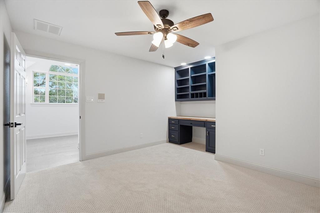 1430 Black Hawk Trail Nemo, TX 76070 - Photo 24 of 40 an empty room with a ceiling fan and a window