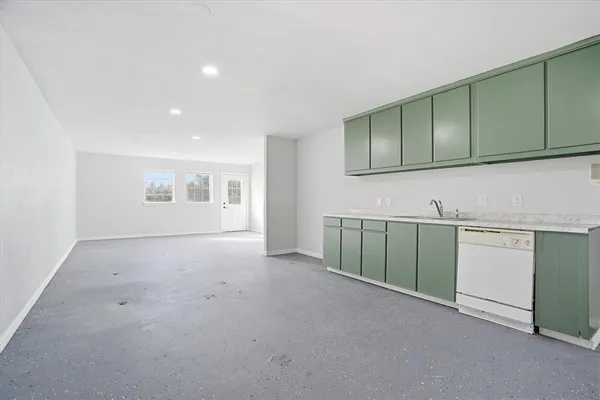 a view of a kitchen with dishwasher and cabinets