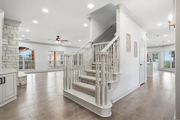 a view of entryway and hall with wooden floor