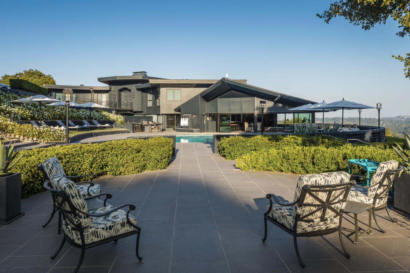835 La Honda Road Woodside, CA 94062 - Photo 14 of 30 a view of a chairs and table on the terrace