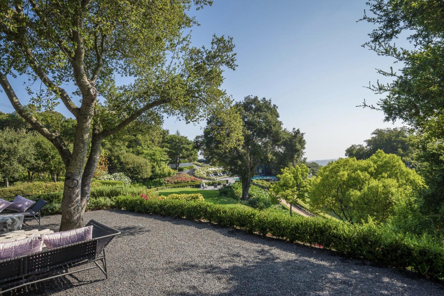835 La Honda Road Woodside, CA 94062 - Photo 19 of 30 a garden view with a seating space