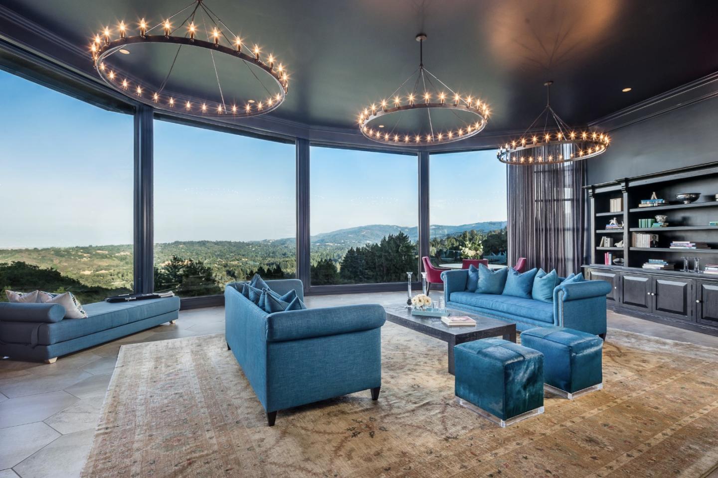 835 La Honda Road Woodside, CA 94062 - Photo 3 of 30 a living room with furniture a chandelier and a large mirror