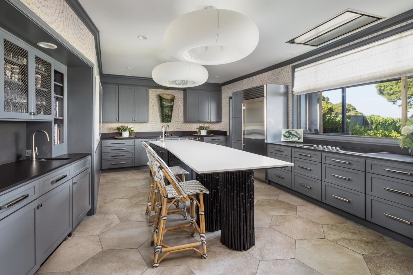 835 La Honda Road Woodside, CA 94062 - Photo 5 of 30 a kitchen with a stove a sink a counter space and dining table