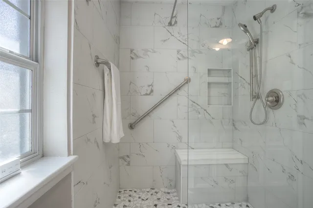 a bathroom with a granite countertop sink and a toilet