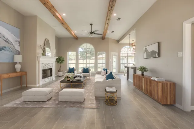 a living room with furniture and a fireplace