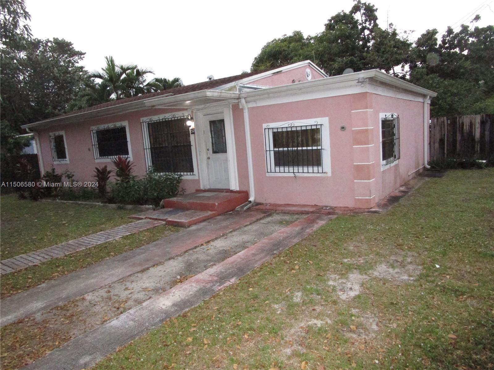 Westside North Miami, FL 33168 - Photo 2 of 13 a front view of house with yard