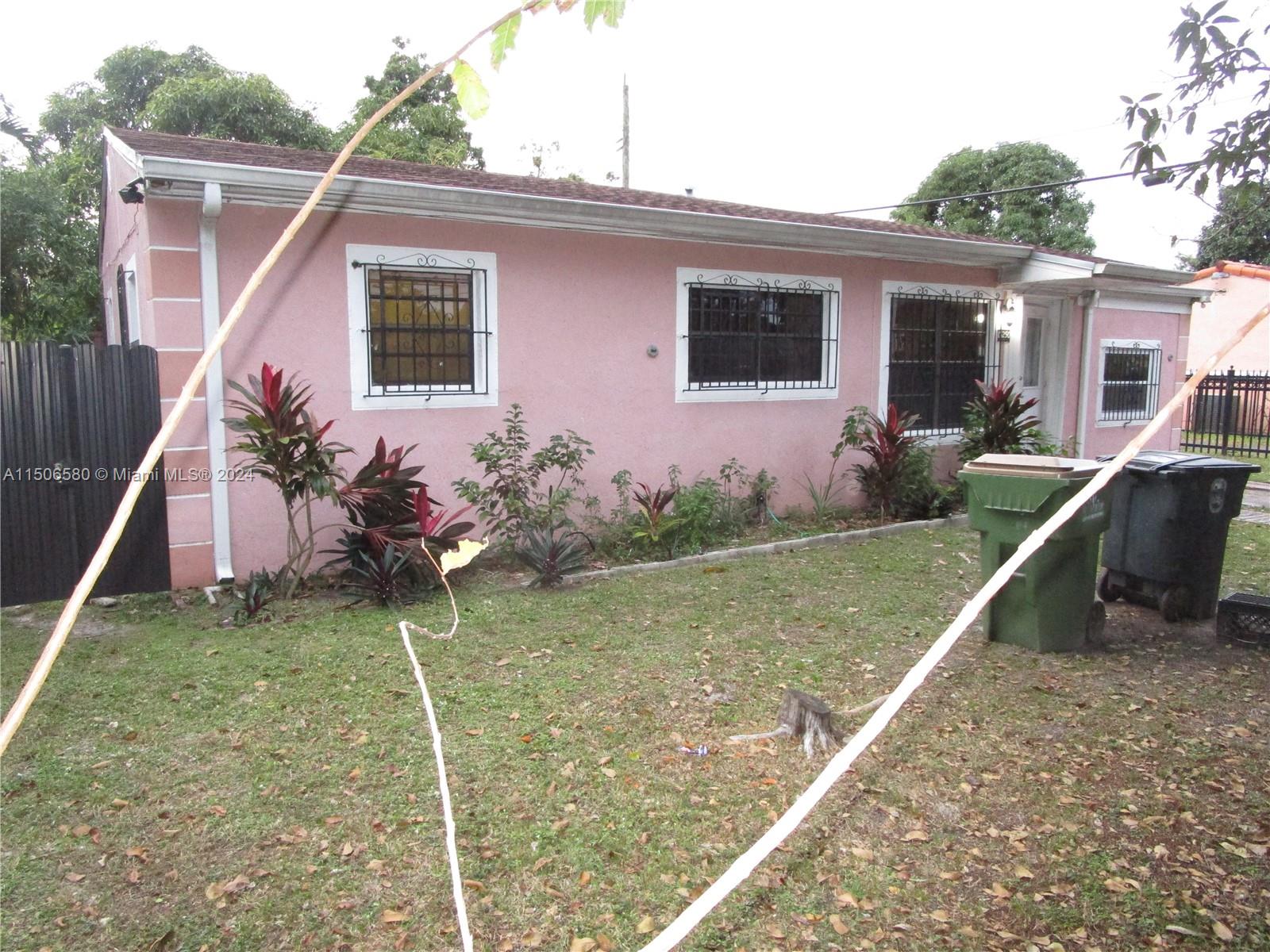 Westside North Miami, FL 33168 - Photo 3 of 13 a view of a house with backyard and sitting area