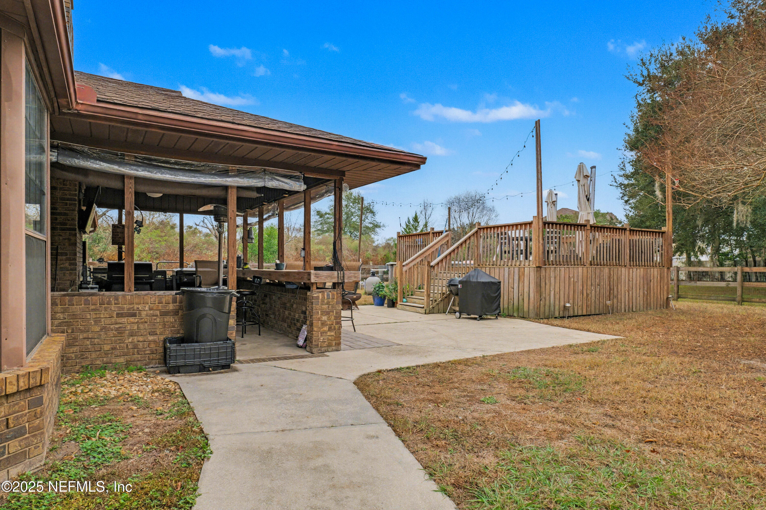 820 Golf Club Road Macclenny, FL 32063 - Photo 13 of 51 a front view of a house with basket ball court