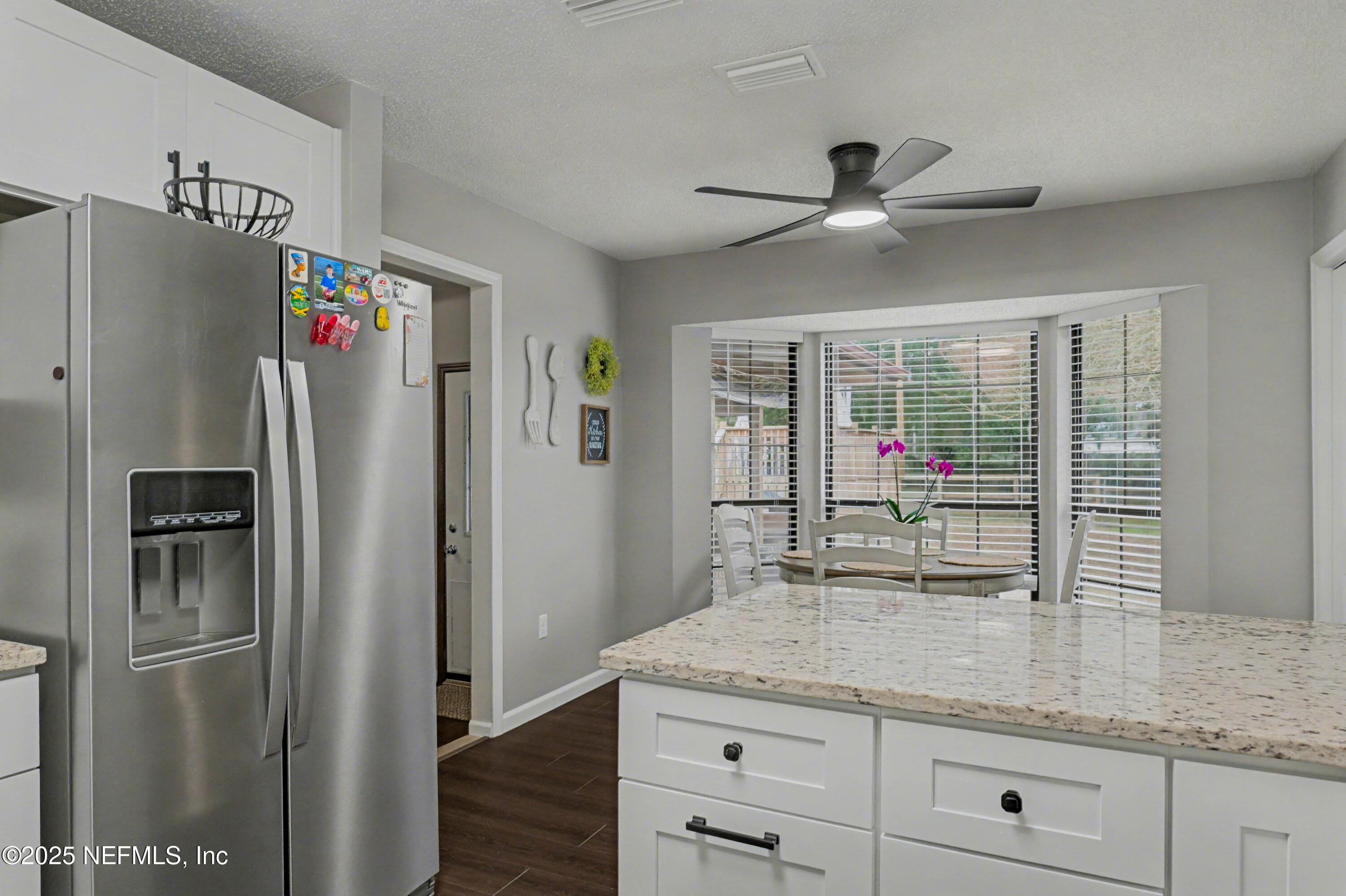 820 Golf Club Road Macclenny, FL 32063 - Photo 15 of 51 a kitchen with stainless steel appliances granite countertop a refrigerator and a sink