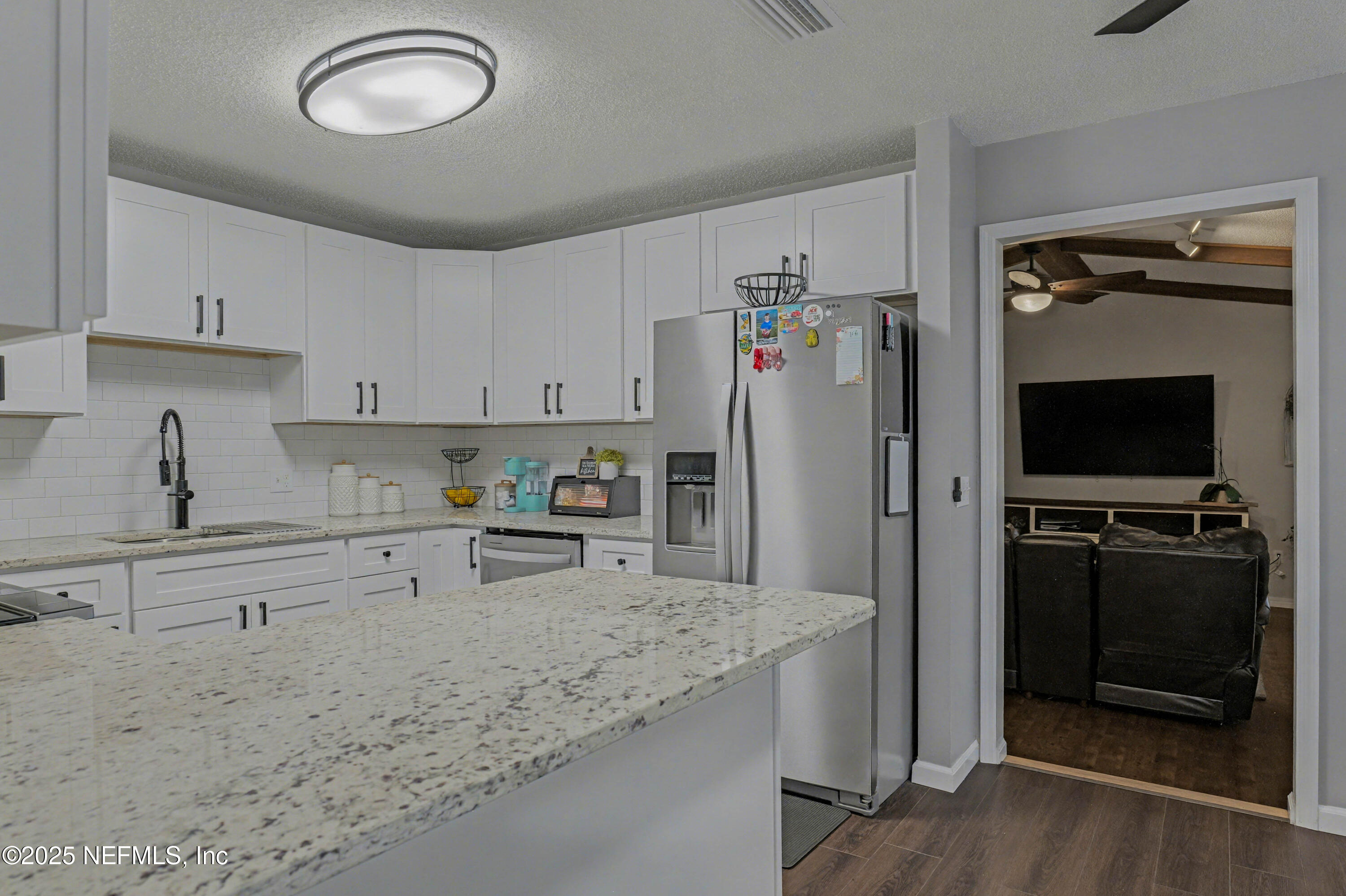 820 Golf Club Road Macclenny, FL 32063 - Photo 16 of 51 a kitchen with refrigerator and window