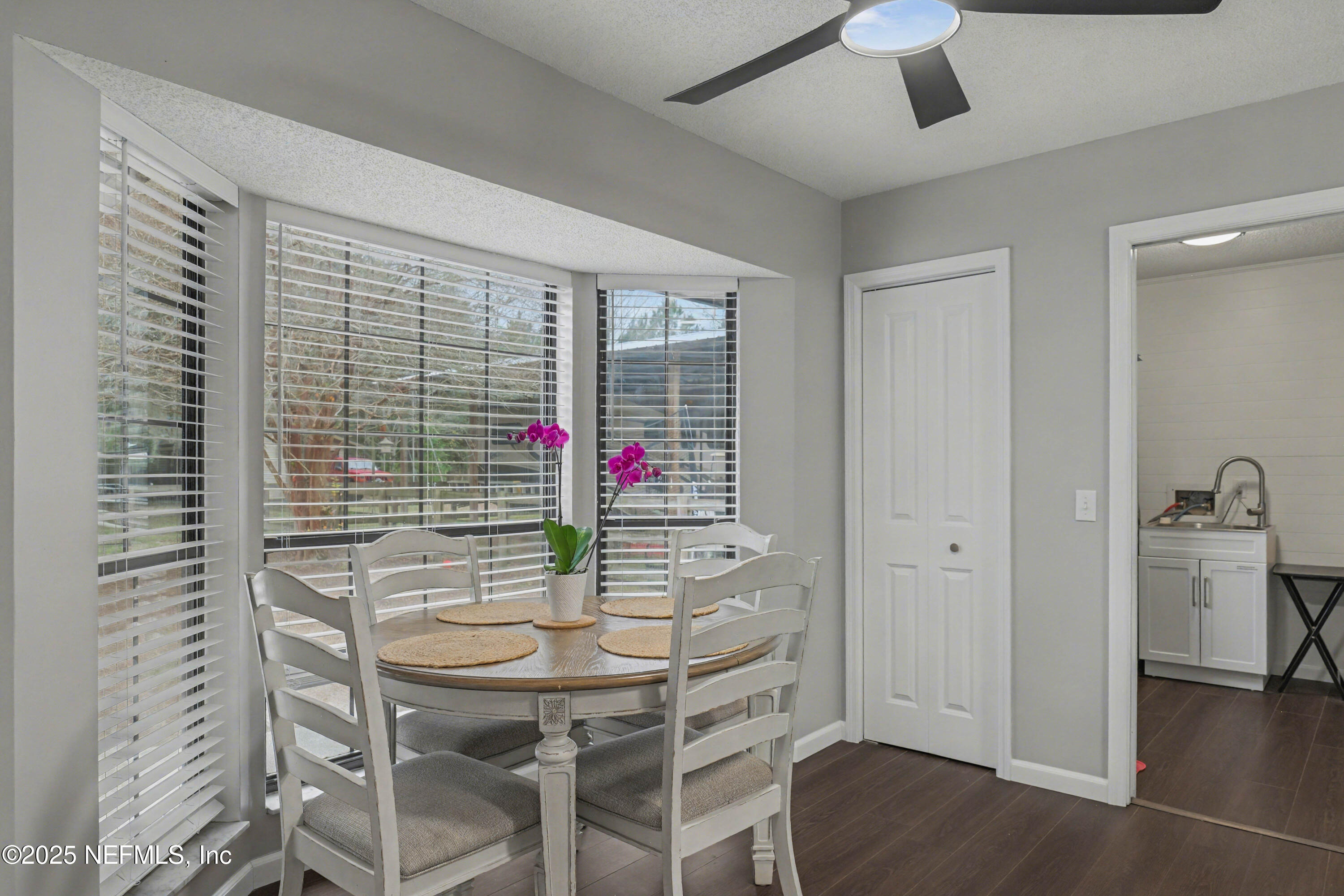 820 Golf Club Road Macclenny, FL 32063 - Photo 17 of 51 a view of a dining room with furniture and wooden floor