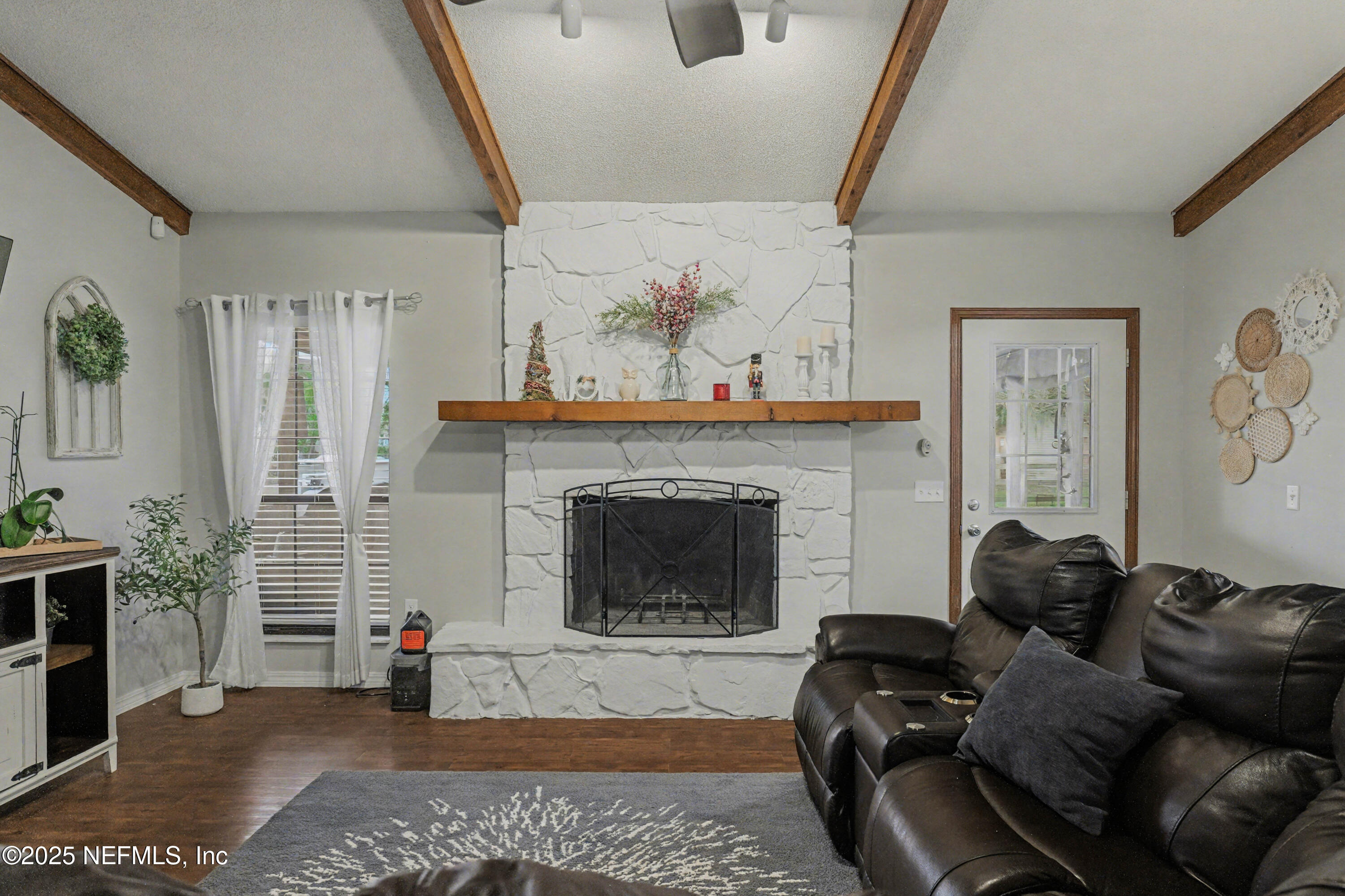 820 Golf Club Road Macclenny, FL 32063 - Photo 18 of 51 a living room with furniture and a fireplace