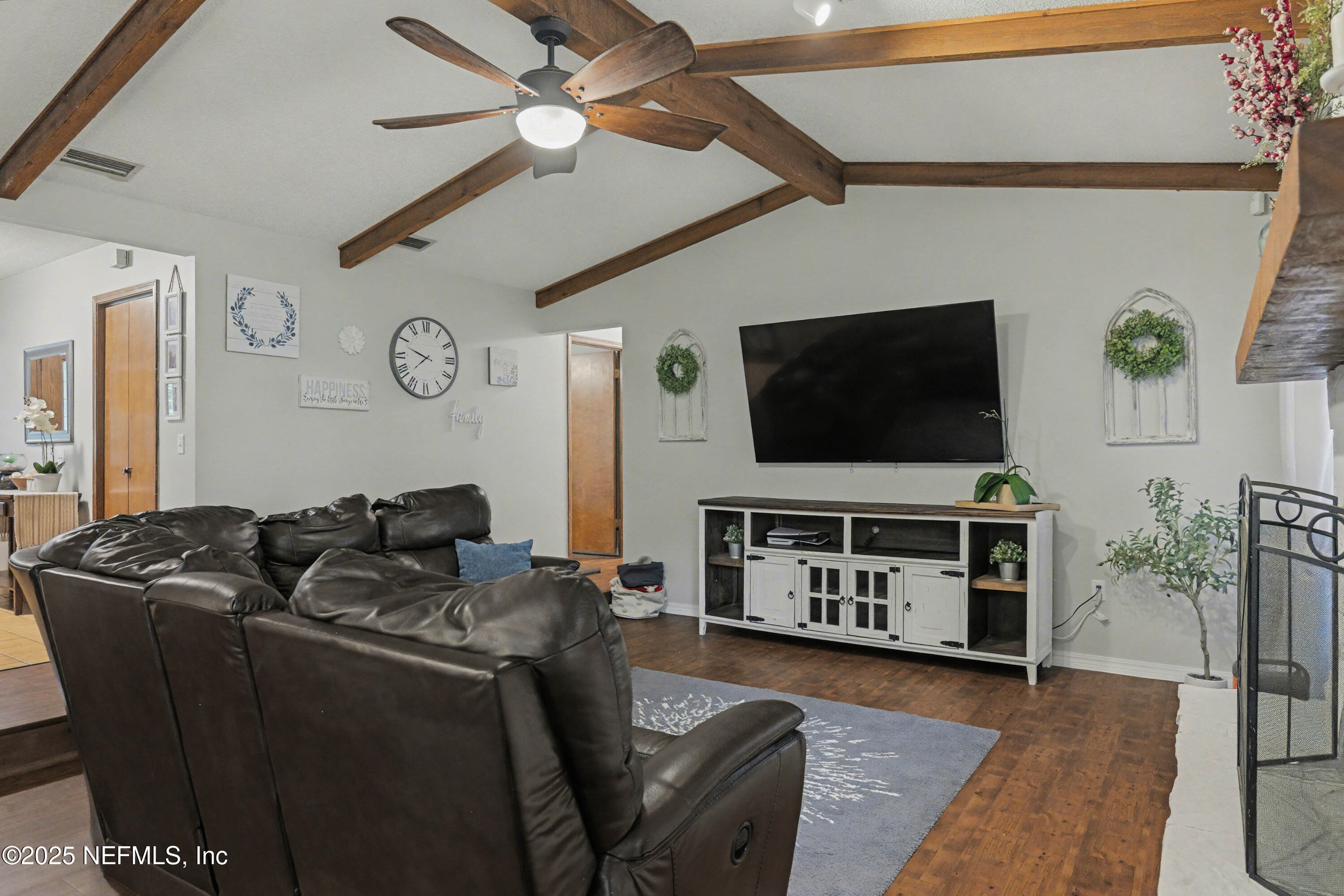 820 Golf Club Road Macclenny, FL 32063 - Photo 19 of 51 a living room with furniture and a flat screen tv