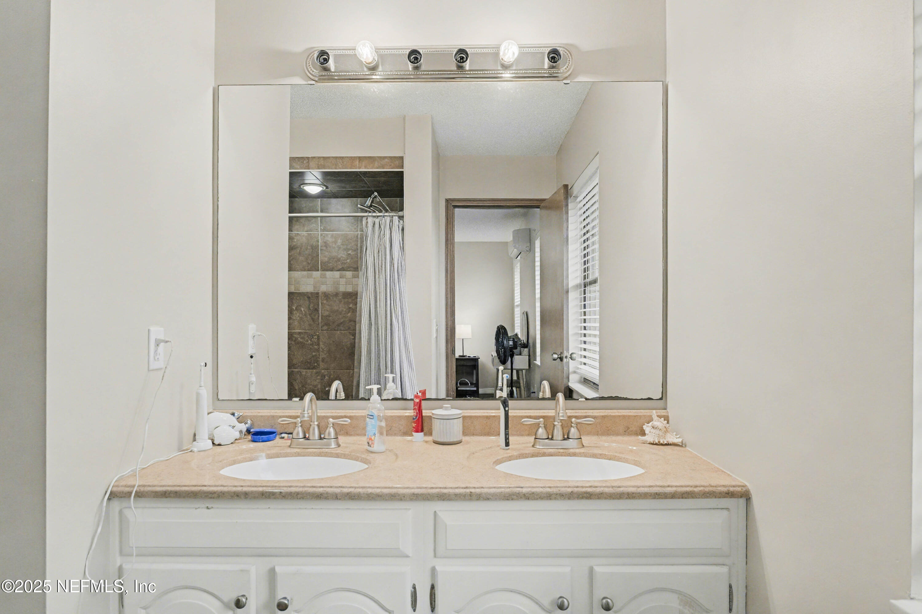 820 Golf Club Road Macclenny, FL 32063 - Photo 24 of 51 a bathroom with a sink and a mirror