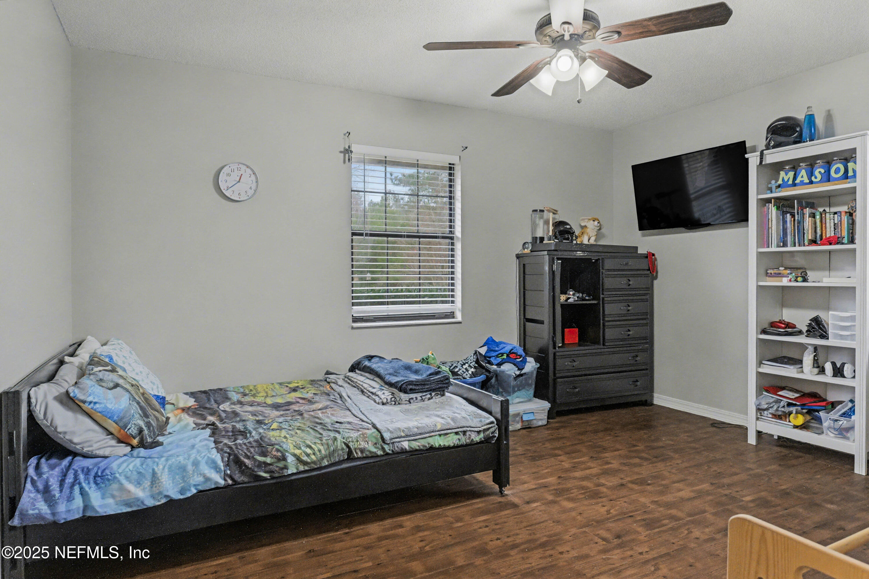 820 Golf Club Road Macclenny, FL 32063 - Photo 27 of 51 a bedroom with bed and flat screen tv