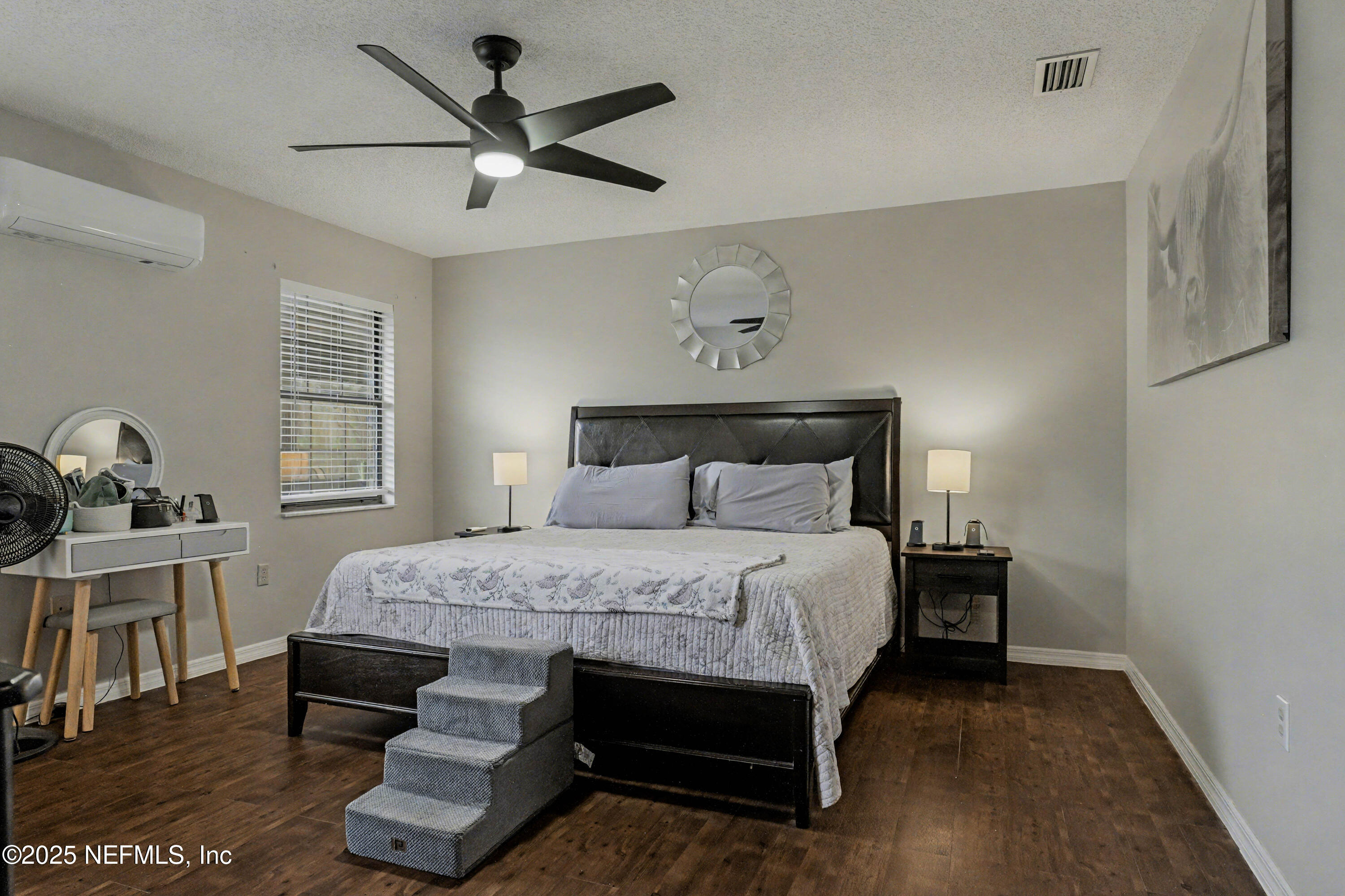 820 Golf Club Road Macclenny, FL 32063 - Photo 29 of 51 a bedroom with a bed a desk and chair