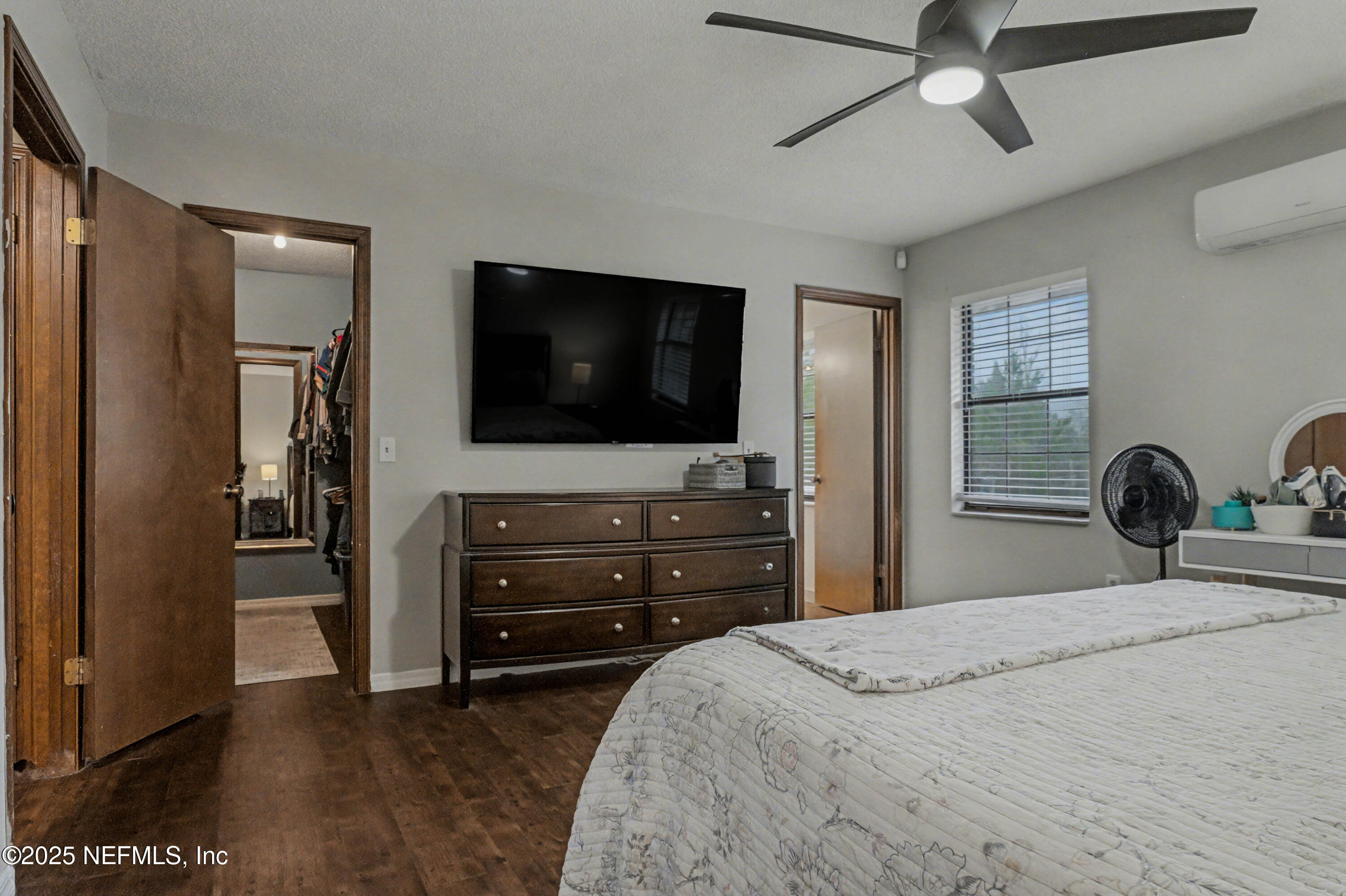 820 Golf Club Road Macclenny, FL 32063 - Photo 31 of 51 a bedroom with a bed and a flat tv screen on dresser