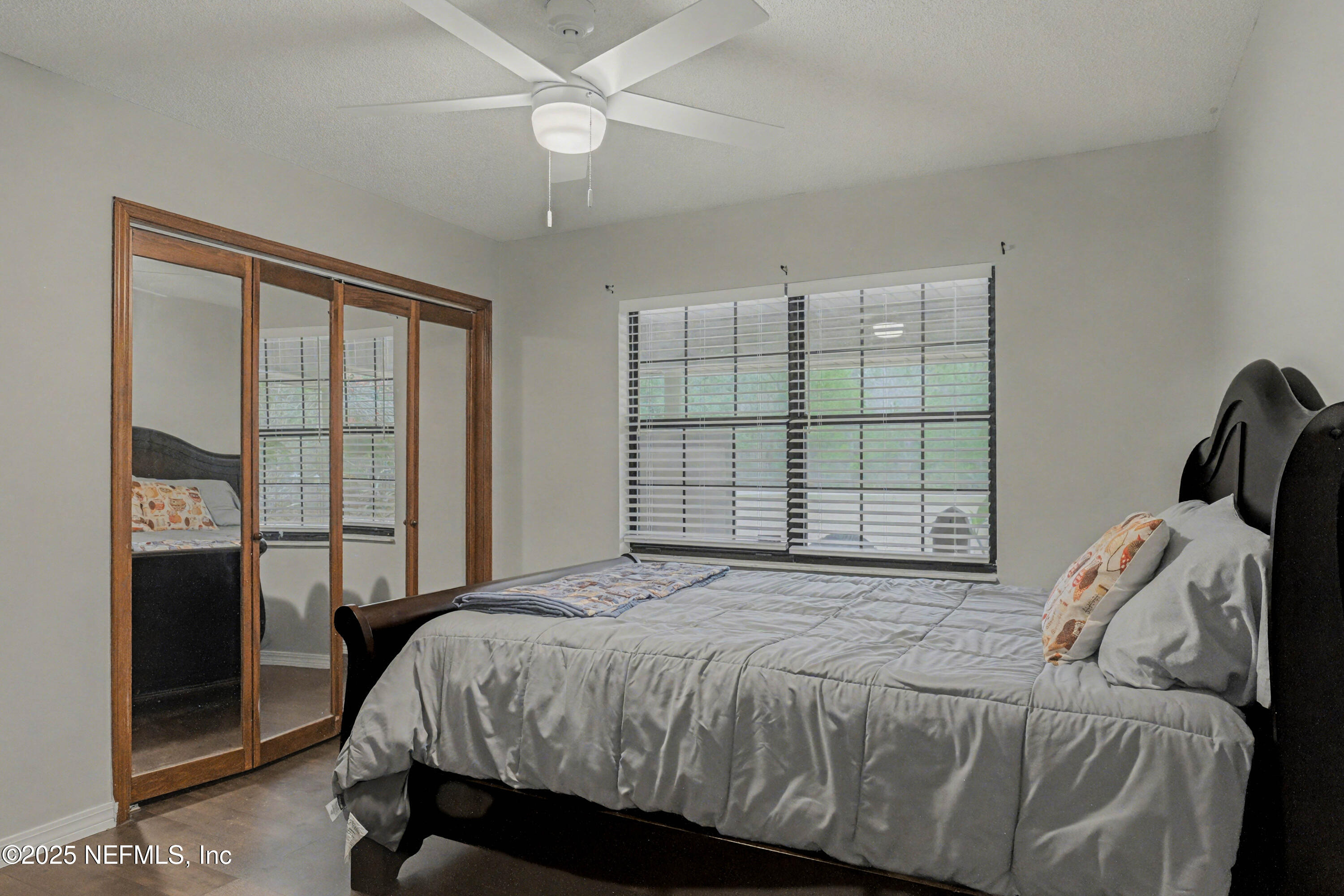 820 Golf Club Road Macclenny, FL 32063 - Photo 32 of 51 a bed sitting in a bedroom next to a window