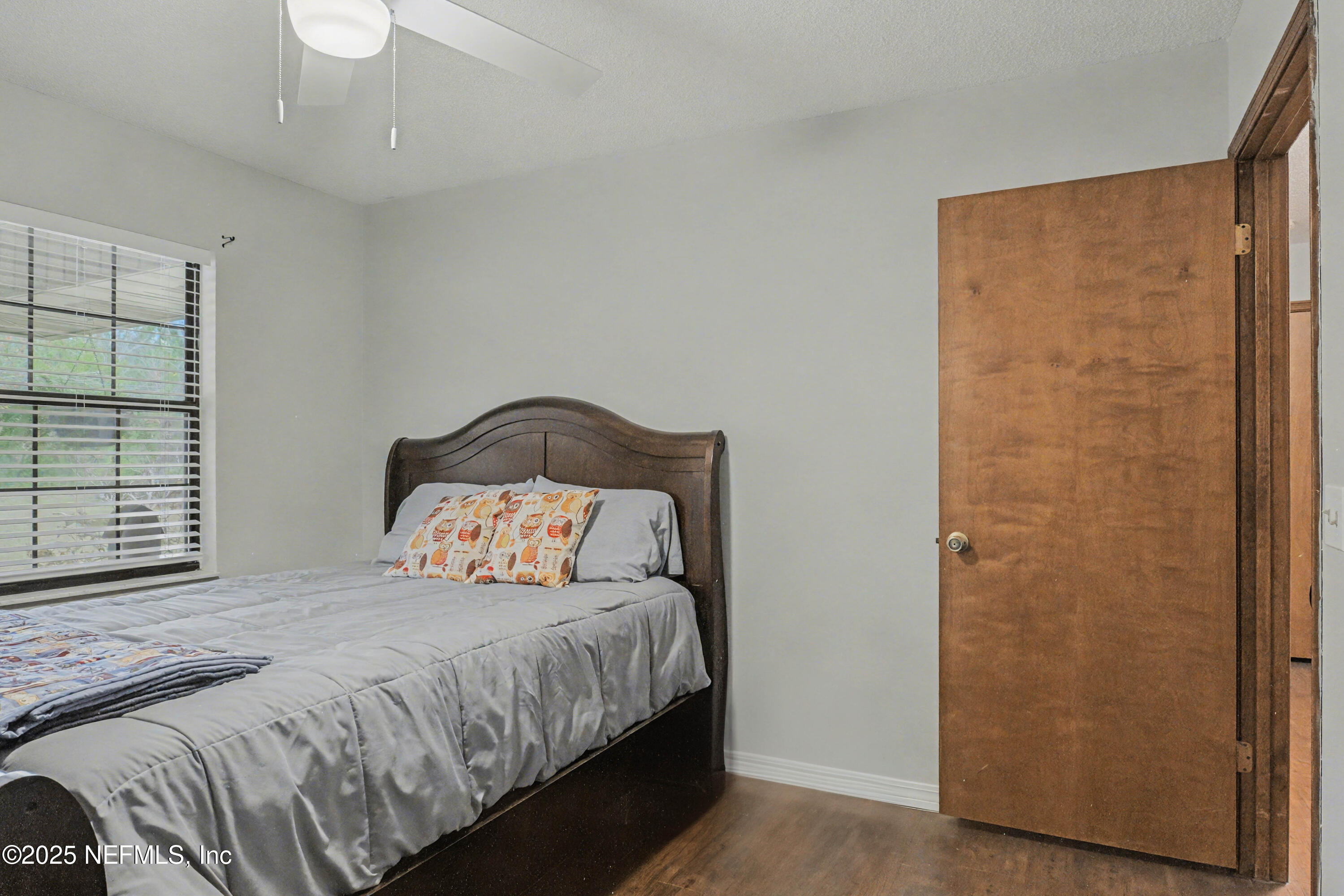 820 Golf Club Road Macclenny, FL 32063 - Photo 33 of 51 a bedroom with a bed and a window