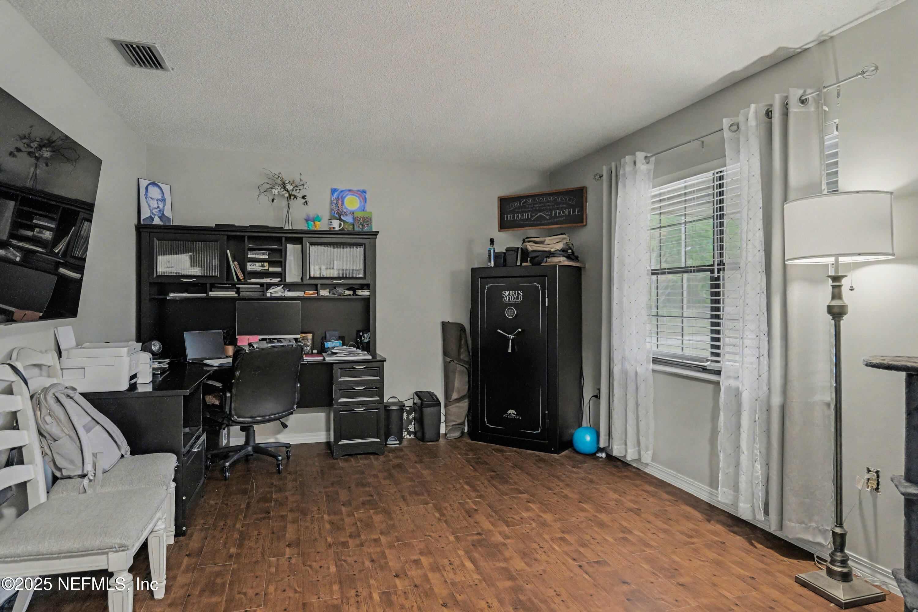 820 Golf Club Road Macclenny, FL 32063 - Photo 35 of 51 a view of a workspace with furniture and a window