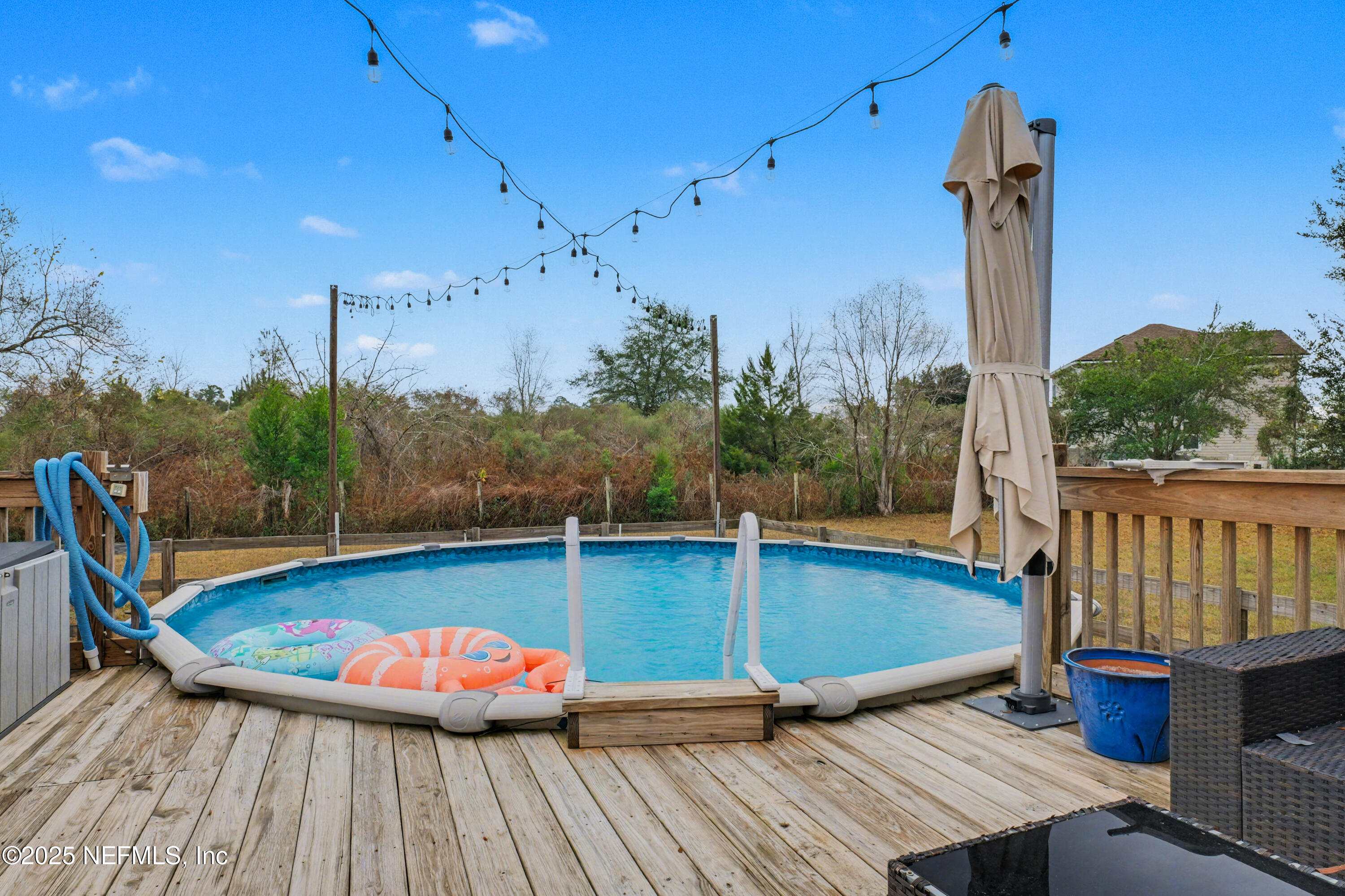 820 Golf Club Road Macclenny, FL 32063 - Photo 41 of 51 a view of a chairs and table on the wooden deck