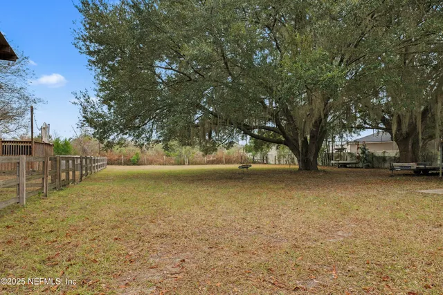 a view of outdoor space with garden and trees