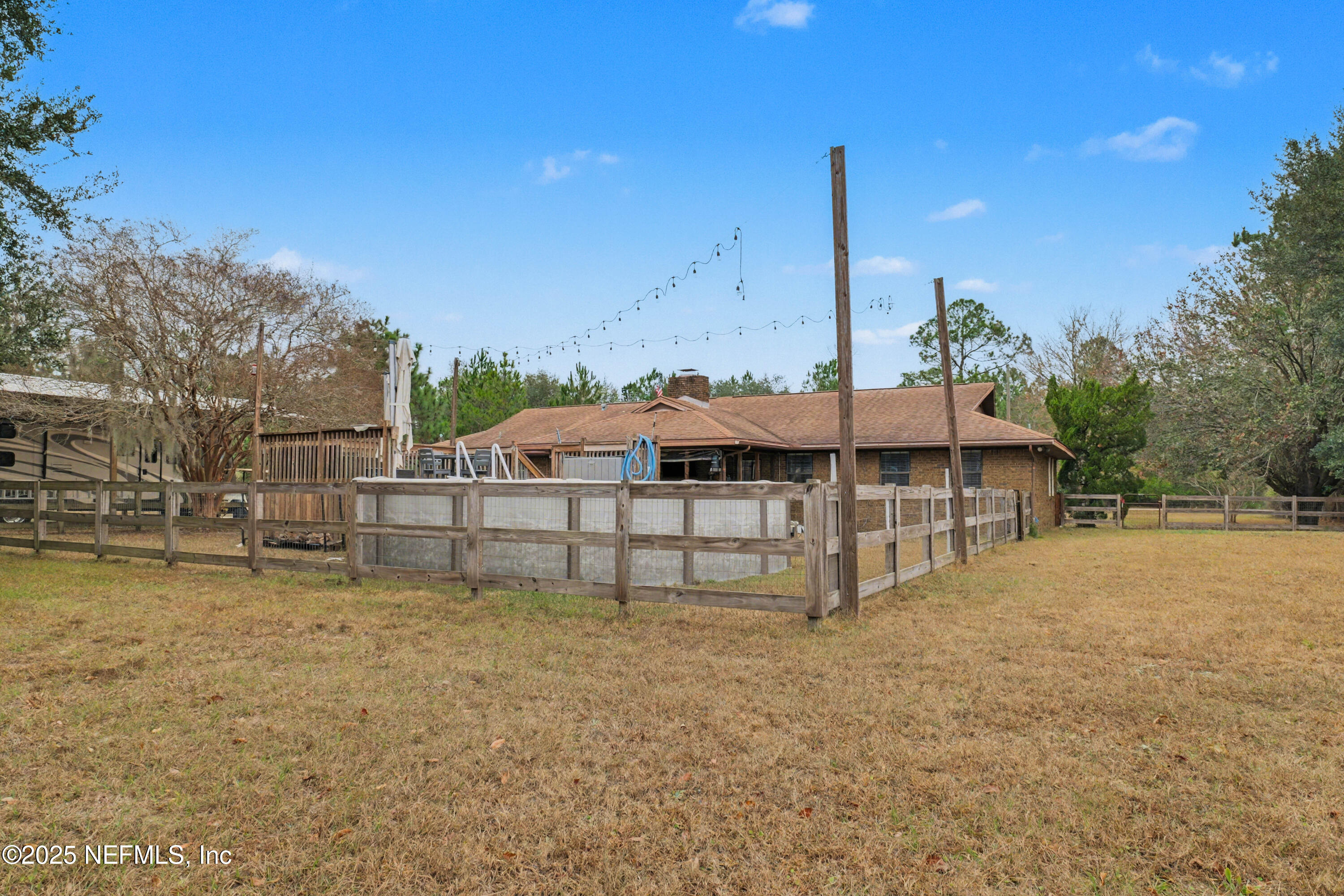 820 Golf Club Road Macclenny, FL 32063 - Photo 44 of 51 a view of a house with a yard and sitting area