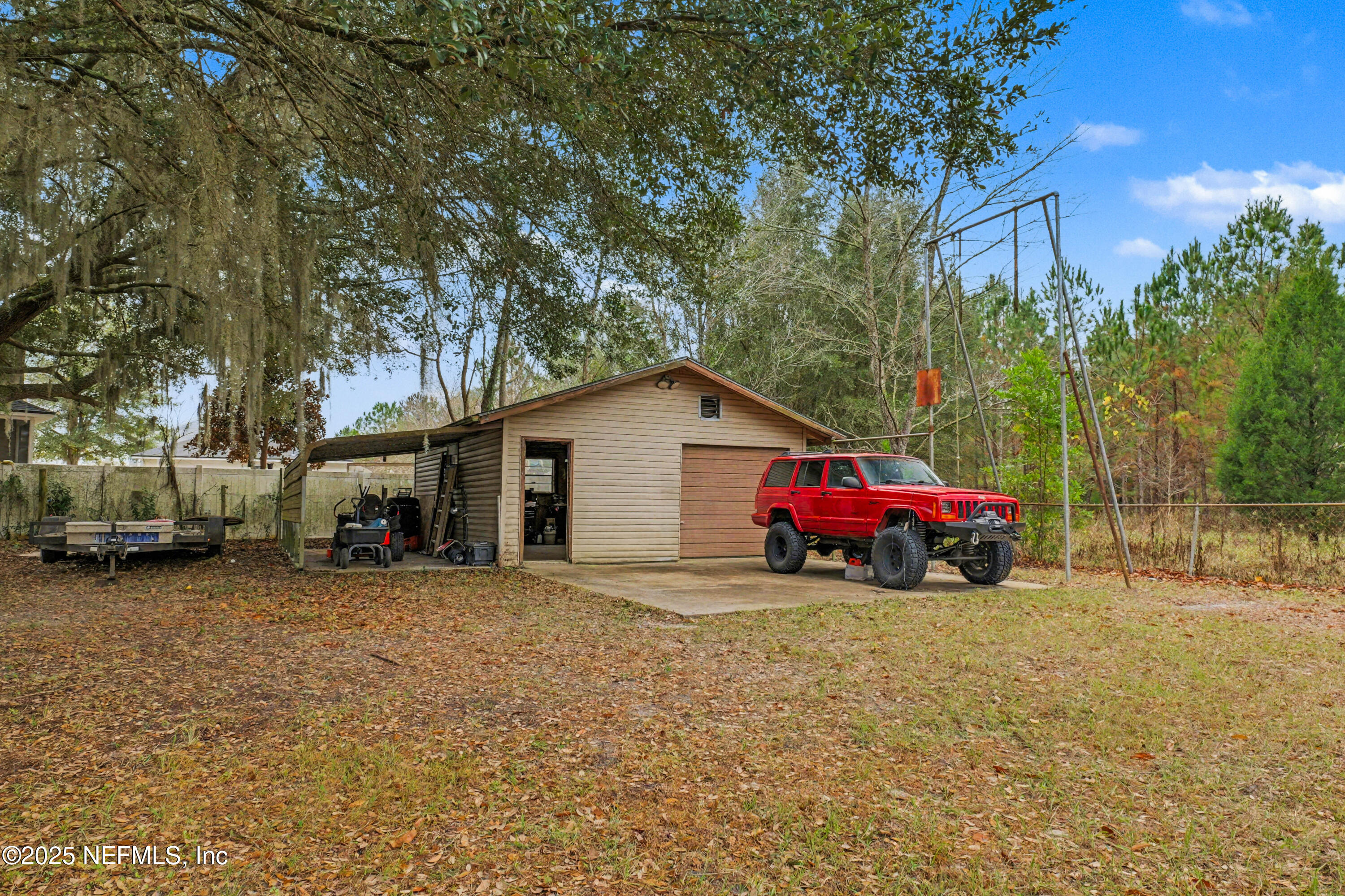 820 Golf Club Road Macclenny, FL 32063 - Photo 47 of 51 a view of a car is parked in front of a house