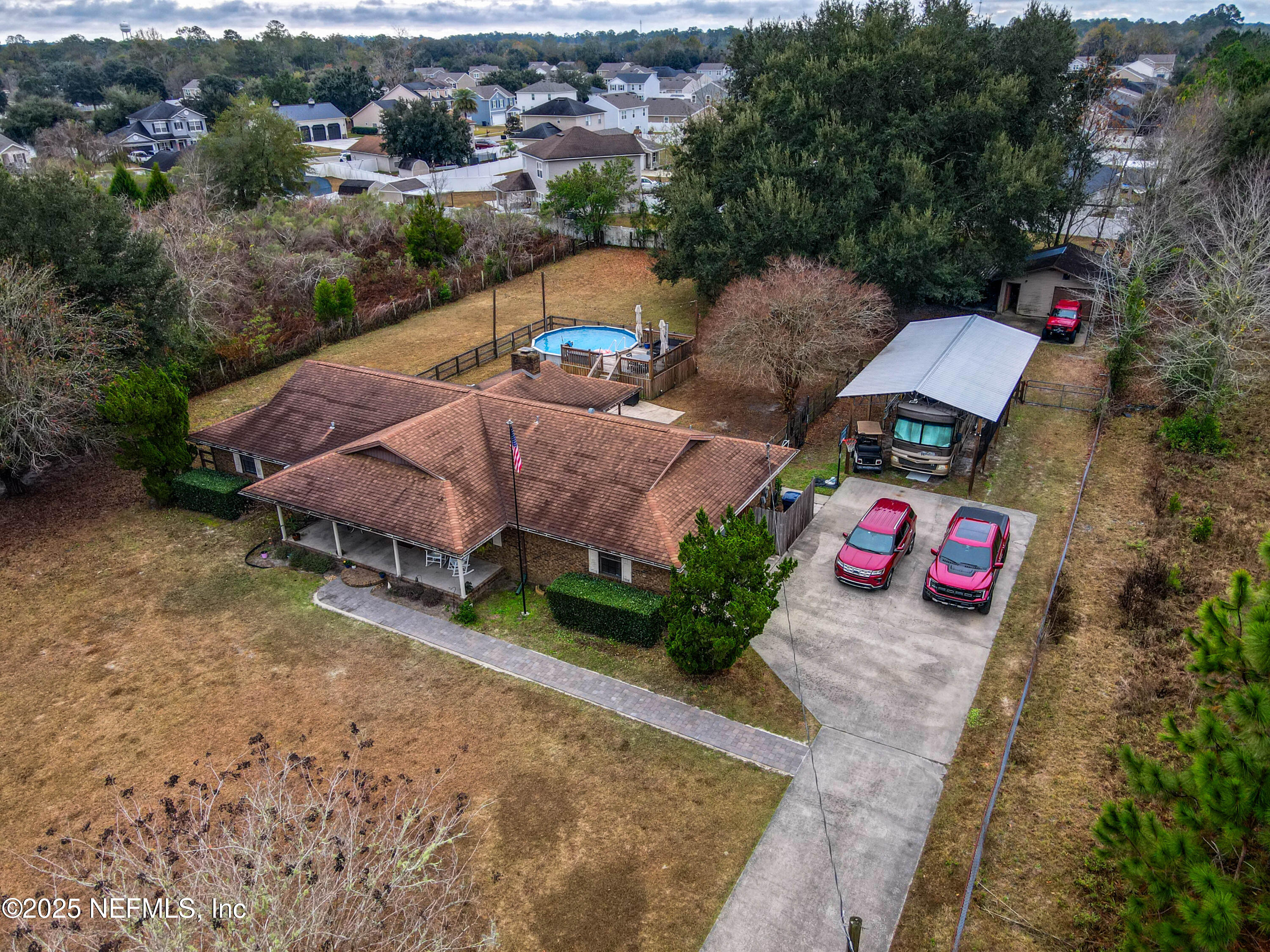 820 Golf Club Road Macclenny, FL 32063 - Photo 6 of 51 an aerial view of a house with garden