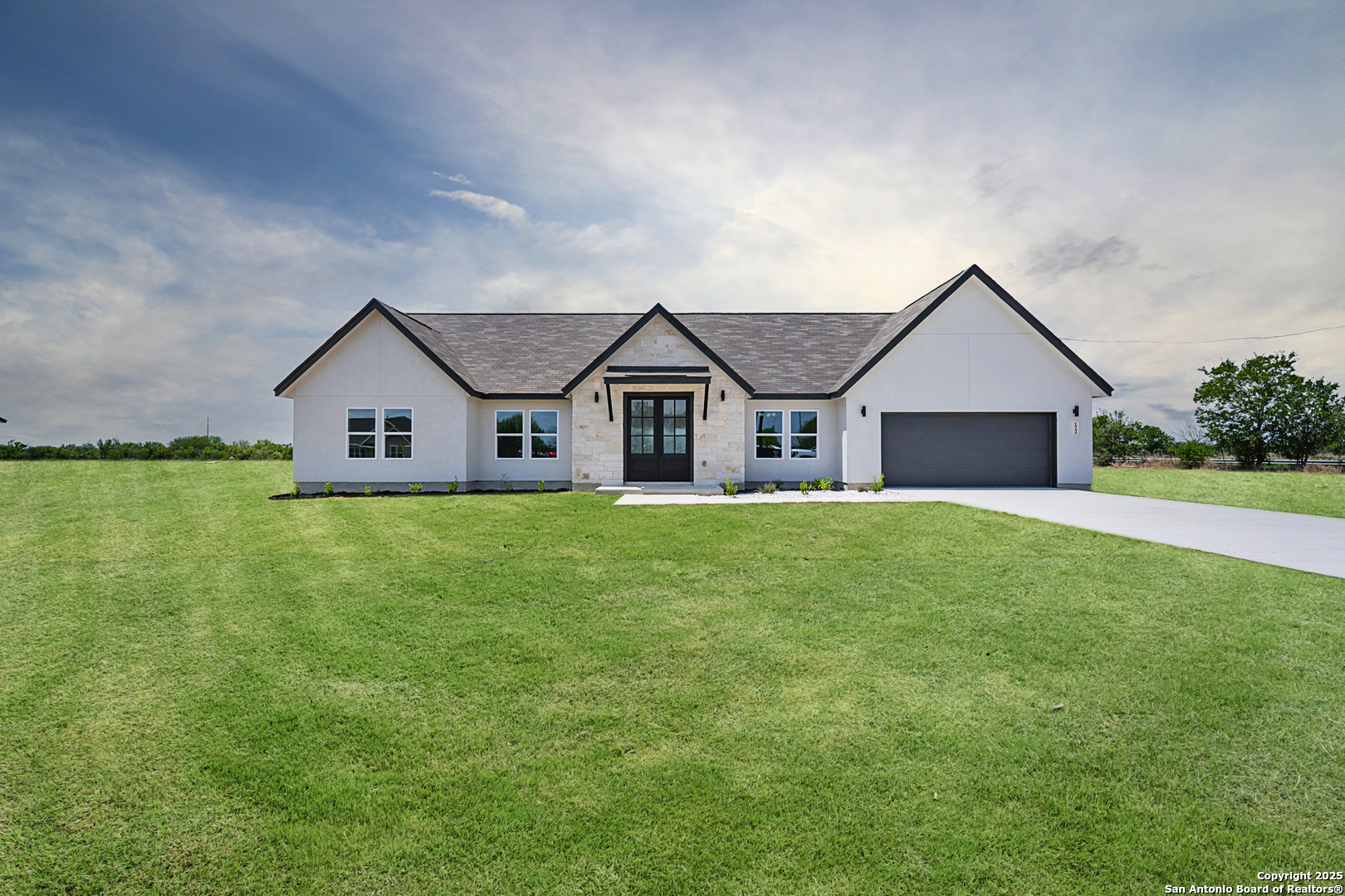 a view of a house with a big yard