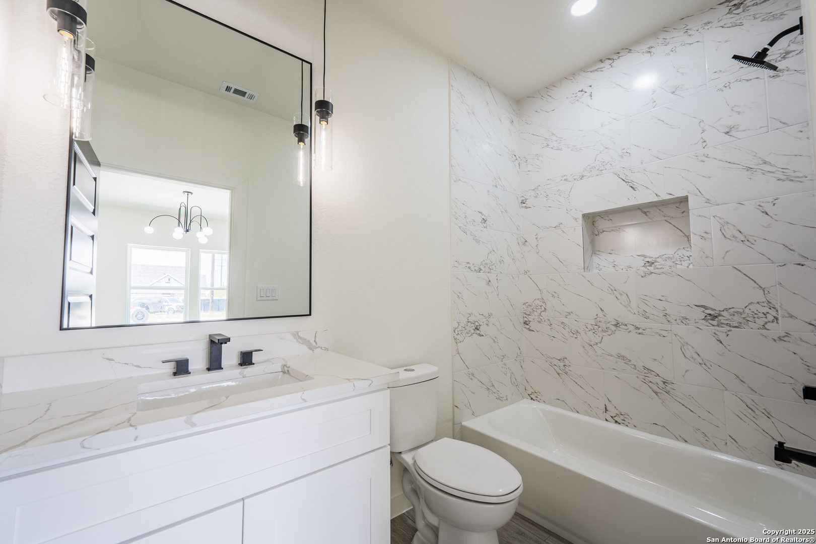 122 Ranchero Way Natalia, TX 78059 - Photo 17 of 31 a bathroom with a sink toilet and shower