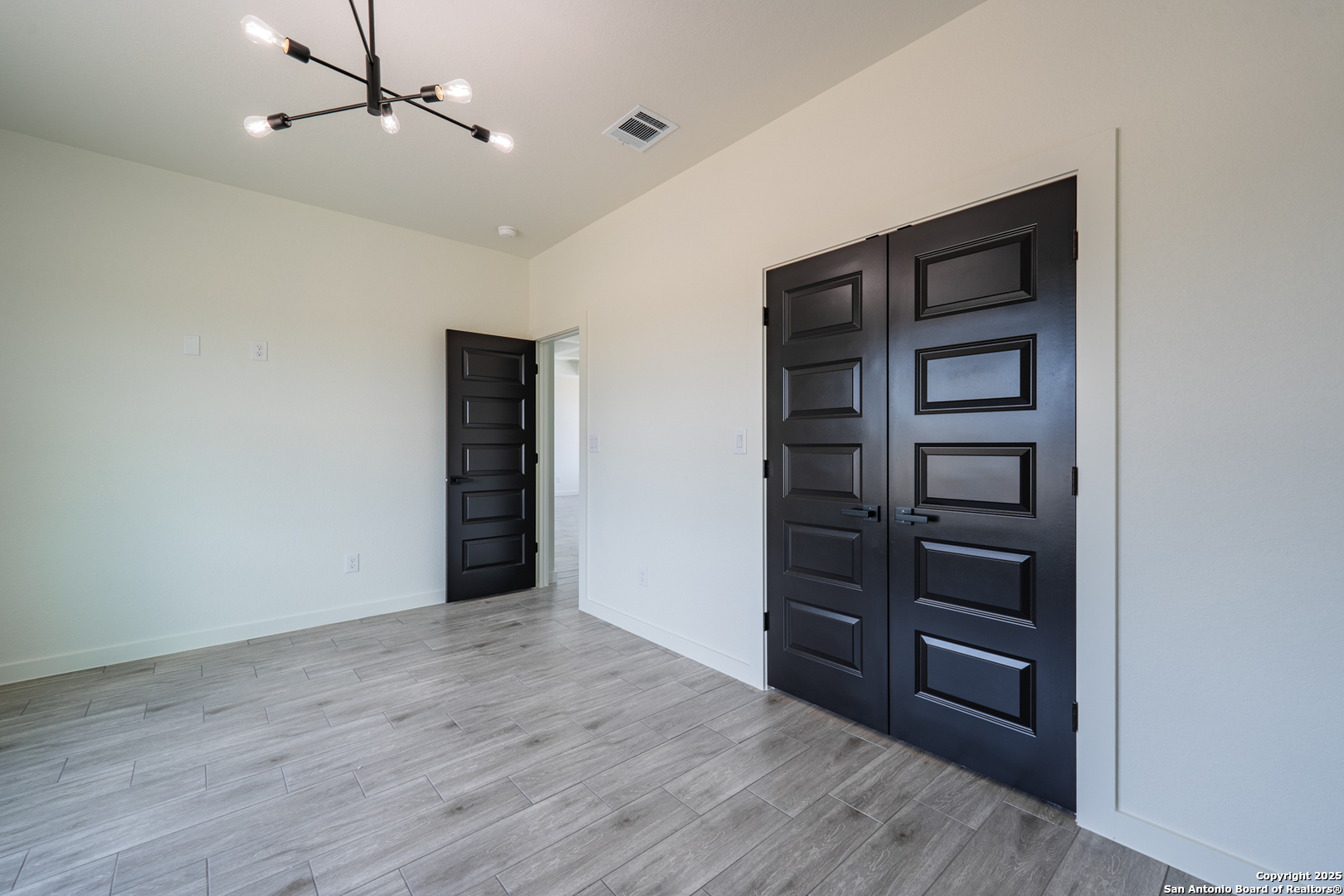 122 Ranchero Way Natalia, TX 78059 - Photo 24 of 31 a view of an empty room with a closet