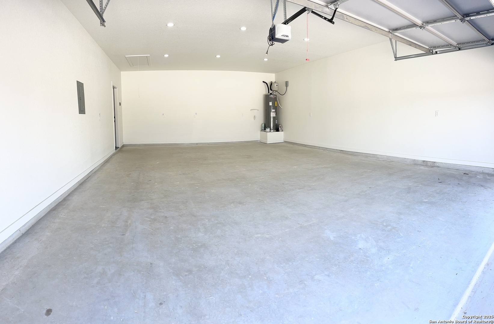 122 Ranchero Way Natalia, TX 78059 - Photo 27 of 31 an empty room with wooden floor and windows