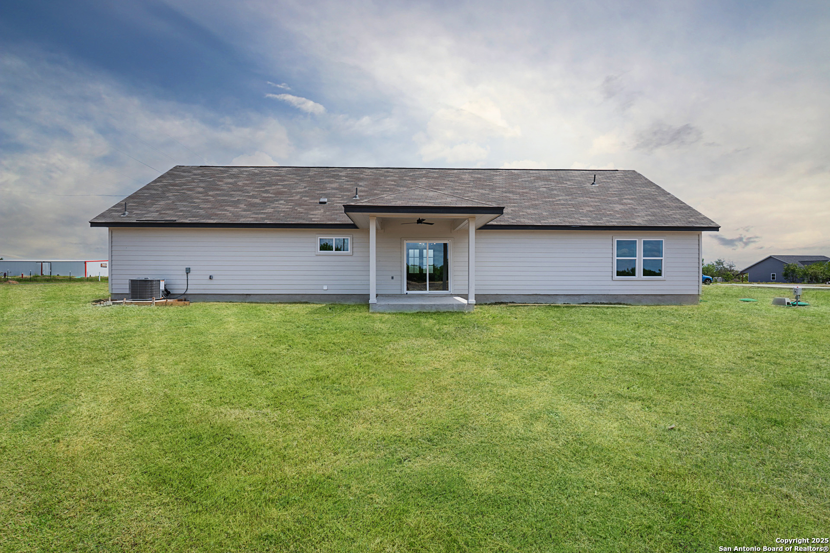 122 Ranchero Way Natalia, TX 78059 - Photo 29 of 31 a house view with a garden space