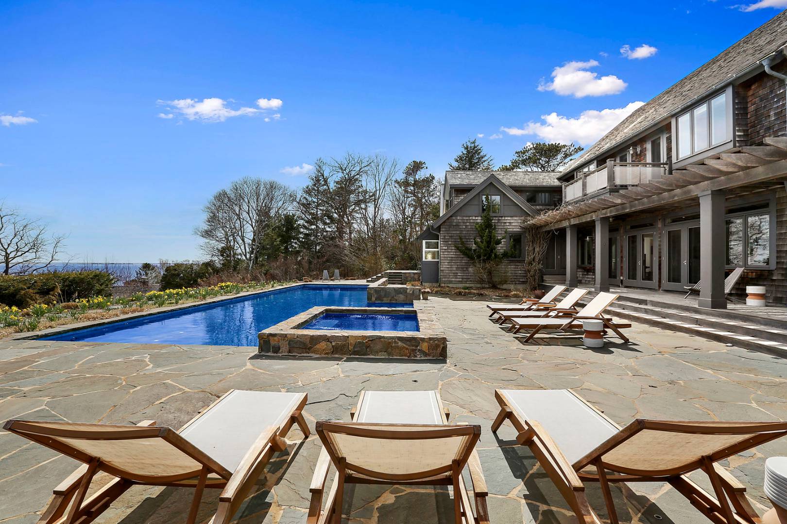 a view of a patio with swimming pool table and chairs