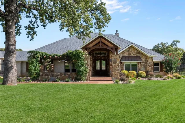a front view of a house with garden