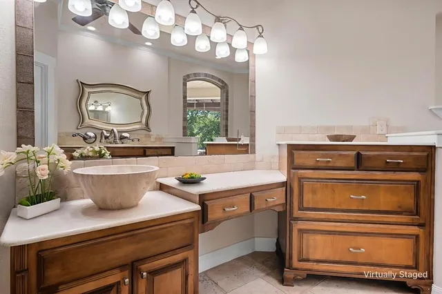 a room with a stove and a mirror