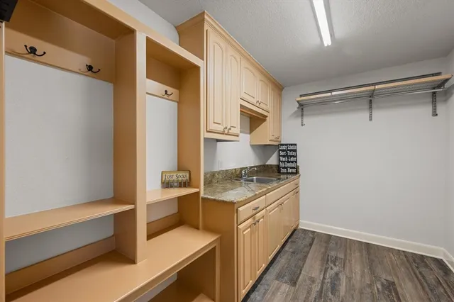 a kitchen with a sink and a refrigerator