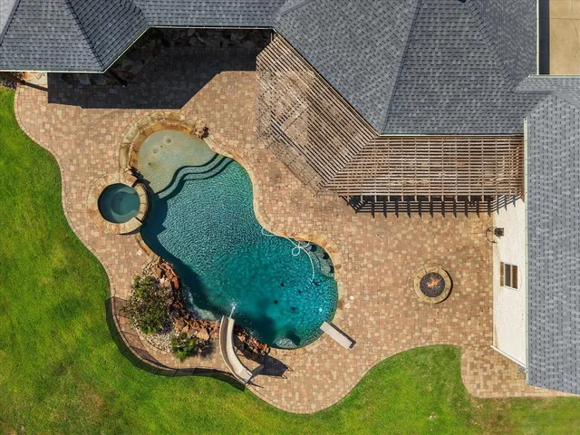 an aerial view of residential houses with outdoor space