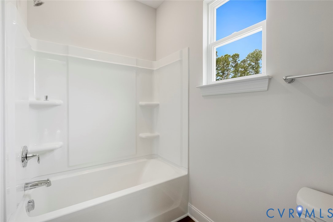 3718 Rocketts Rdg Drive Goochland, VA 23063 - Photo 3 of 13 a white bath tub sitting next to a white toilet and vanity
