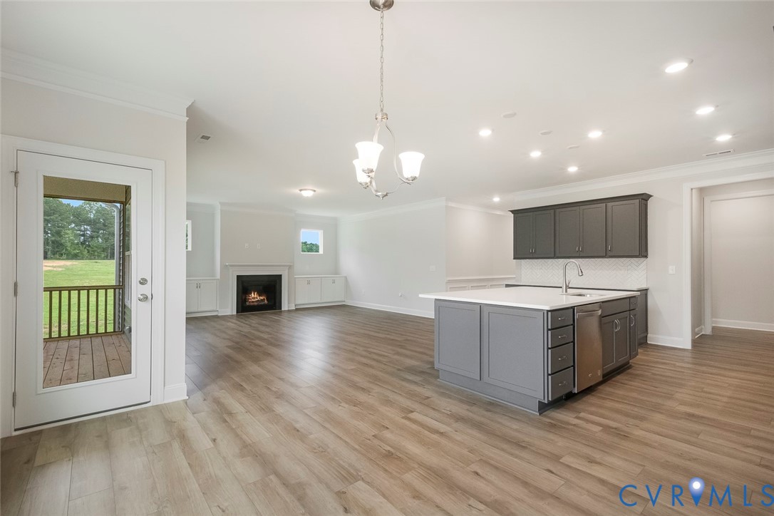 3718 Rocketts Rdg Drive Goochland, VA 23063 - Photo 6 of 13 a kitchen with stainless steel appliances granite countertop a stove and a wooden floors