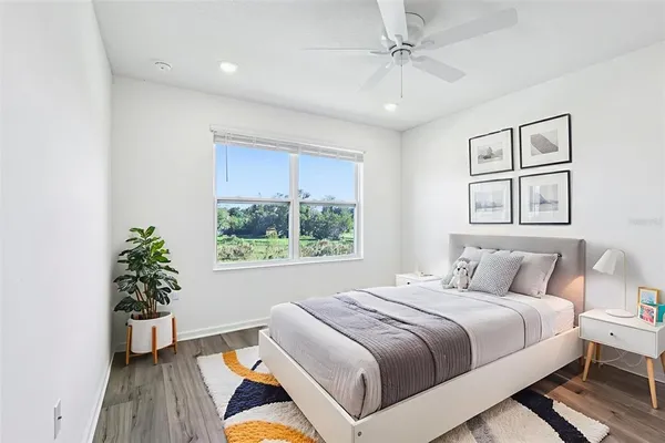 a bedroom with a large bed and a window